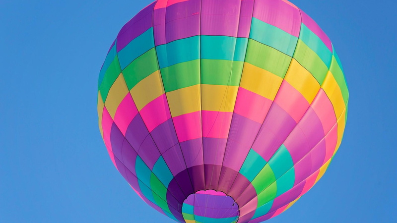 flying, low angle view, pattern, blue, outdoors, hot air balloon, sport, sky, ballooning festival, ballons, nature, no people, adventure, clear sky, air vehicle