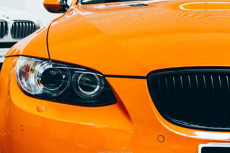 land vehicle, stationary, headlight, car, city, mode of transportation, motor vehicle, orange color, BMW E92 M3, yellow, no people, close-up, BMW, public transportation