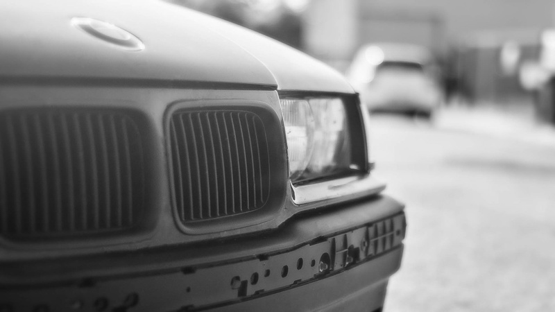 lighting equipment, luxury, drift, vintage car, city life, motor vehicle, selective focus, retro styled, street, outdoors, focus on foreground, BMW, mode of transportation