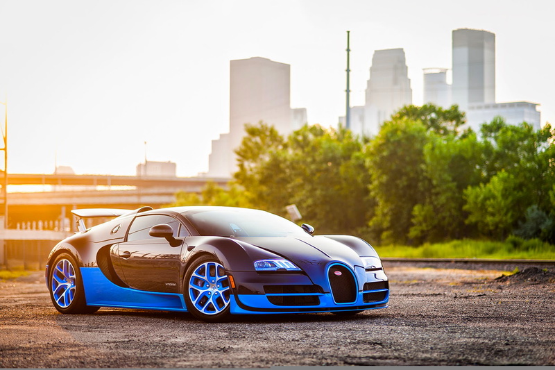 Front, luxury, Spoiler, Veyron, building exterior, road, wealth, built structure, personal land vehicle, outdoors, Sun, black, mode of transportation, Sport