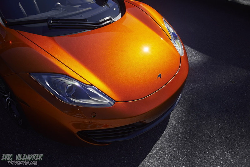 lighting equipment, land vehicle, parking, reflection, McLaren, close-up, motor vehicle, outdoors, car, transportation, vehicle hood, no people, orange color