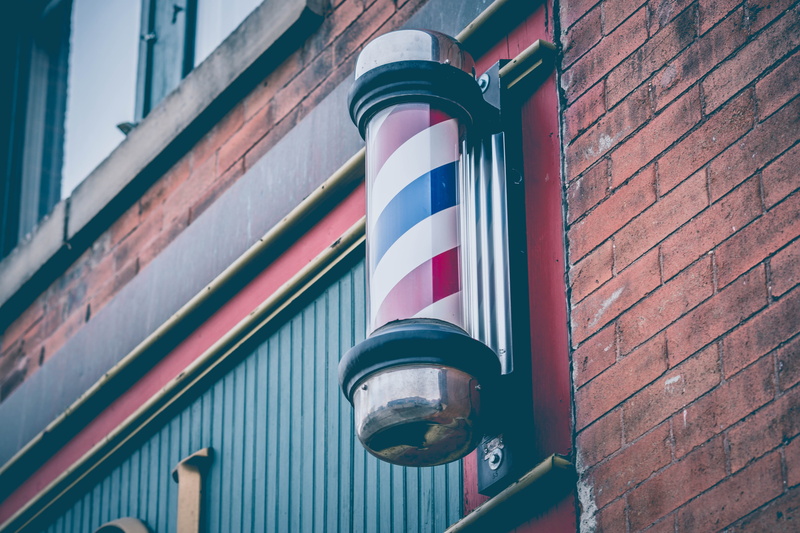wall, low angle view, barber shop, striped, brick wall, urban, no people, lighting equipment, building, street, red, fargo, wall - building feature