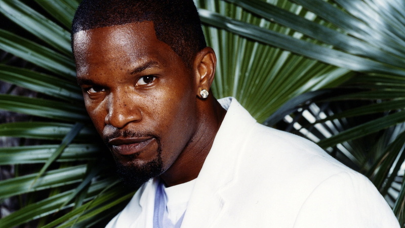 palm leaf, close-up, serious, jamie foxx, tropical climate, face, looking at camera, one person, young adult, front view, leaf, mid adult, adult, palm tree