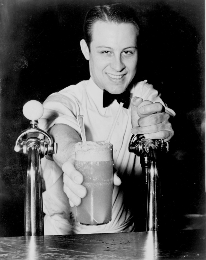 soda jerk, black and white, man, young adult, sweet, ice cream, drinks, glass, container, fresh, male, soda, happiness, looking at camera, lifestyles, one person