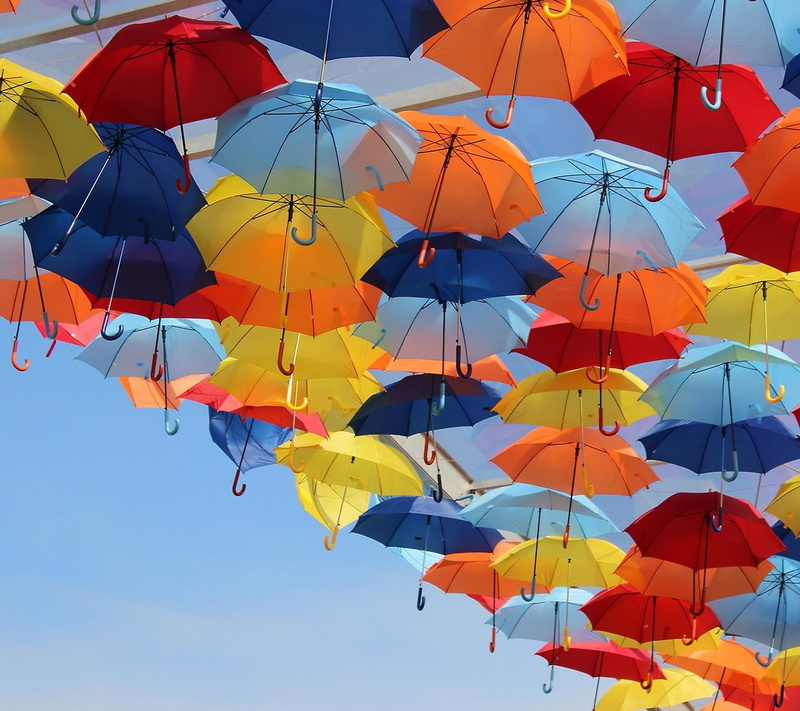 safety, clear sky, security, variation, outdoors, umbrella, sunlight, colorful, multi colored, low angle view, mid-air, day, sky, large group of objects