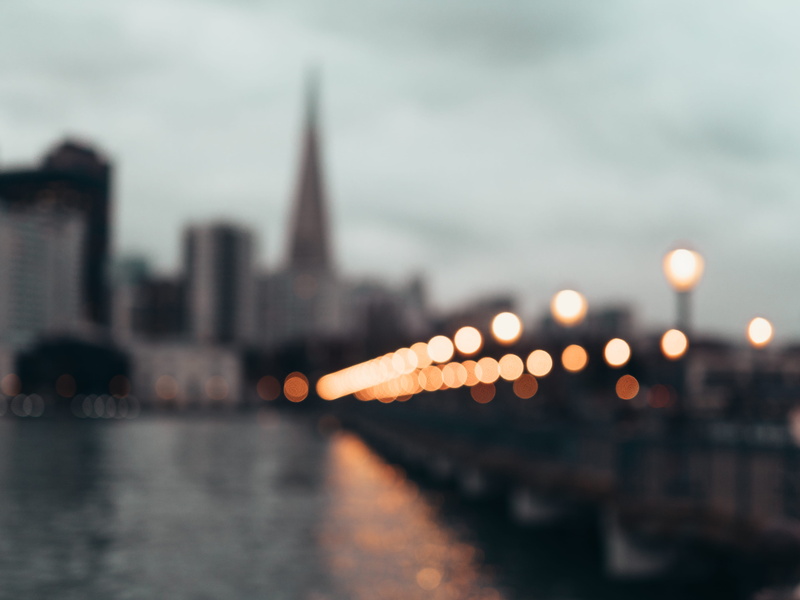 architecture, bridge - man made structure, streetlight, night, city, no people, financial district, spire, unfocused, skyscraper, streetlamp, office building exterior