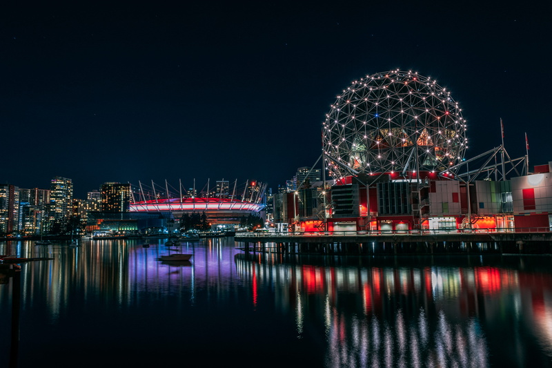 overlooking, buildings, office building exterior, skyline, ferris wheel, waters, night, boat, passing, building, metropolis, sky, science world, nightlife