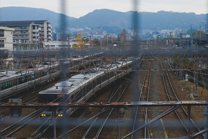 transportation, town, train, high angle view, daytime, building exterior, train track, railroad, railway, 5K, day, passenger train, built structure, mountain