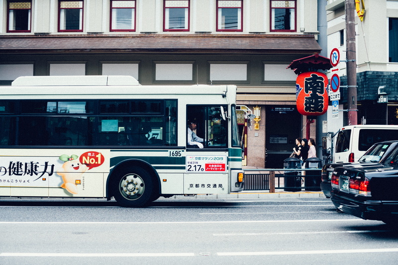 architecture, street, text, mode of transportation, outdoors, japan, built structure, van, signage, travel, land vehicle, transportation, motion, traffic