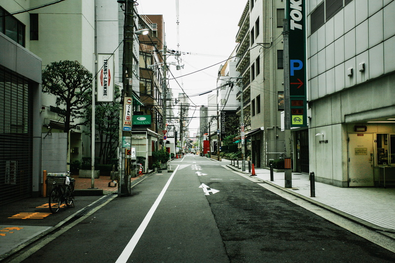 street, kyoto, day, urban, concrete, symbol, road, incidental people, bike, architecture, black, machine, japan, tarmac, sign, building exterior, wheel
