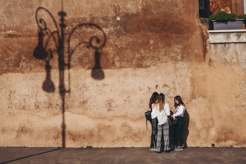 emotion, near, symmetry, brown, couple - relationship, silhouette, group, positive emotion, day, togetherness, roma, conversation, wall, sun, travelers
