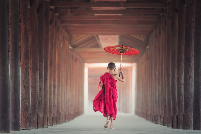 adult, belief, culture, place of worship, close-up, focus, architectural column, smile, real people, walking, built structure, daylight, rear view, monastery