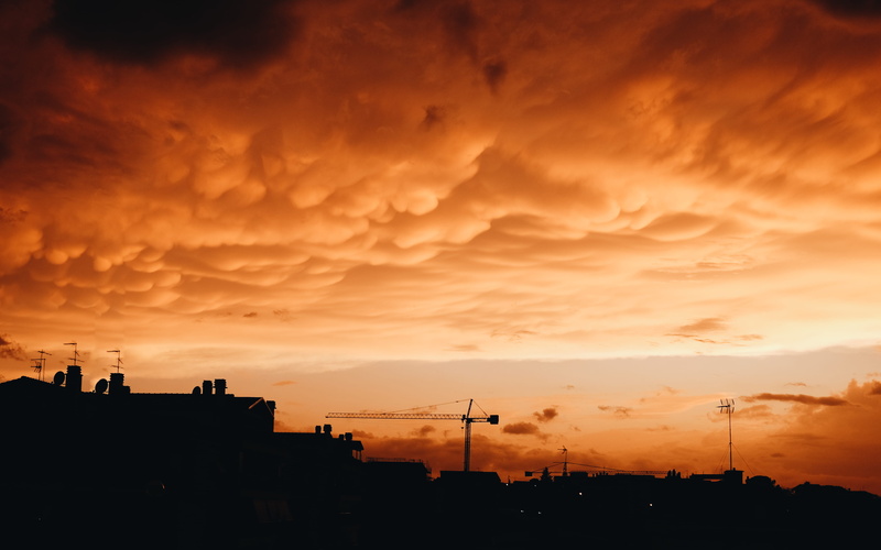 clouds, beauty in nature, residential district, construction, cloud - sky, no people, dramatic sky, cloud, silhouette, cityline, dusk, building, orange color