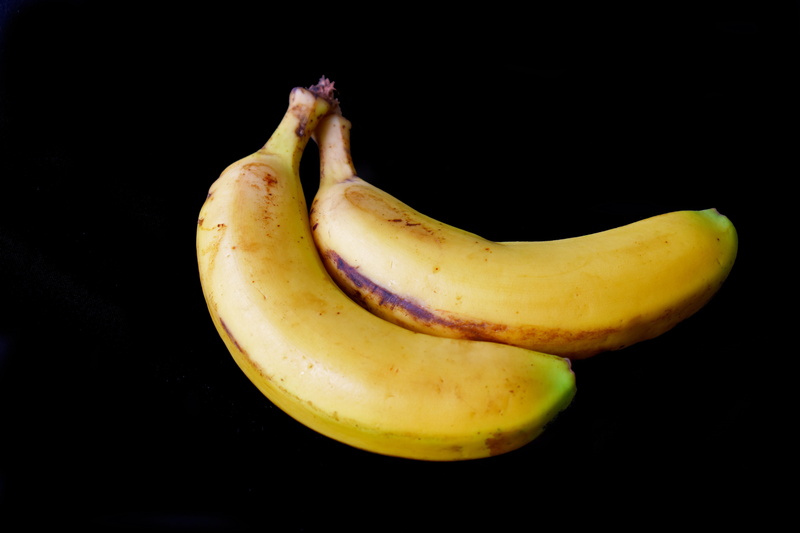 healthy eating, black background, snack, fruit, indoors, bananas, freshness, banana, colored background, herbaceous, yellow, ripe, banana pair, wellbeing