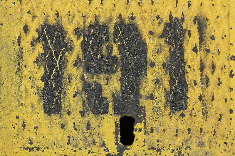 close-up, full frame, aged, sign, black color, day, text, metallic, metal, aging, yellow, concrete, backgrounds, corrosion, metal texture, outdoors, built structure