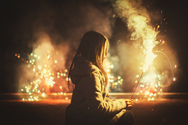 hairstyle, lifestyles, firework, glowing, sparks, night, women outdoors, three quarter length, adult, firework display, side view, one person, nature, illuminated