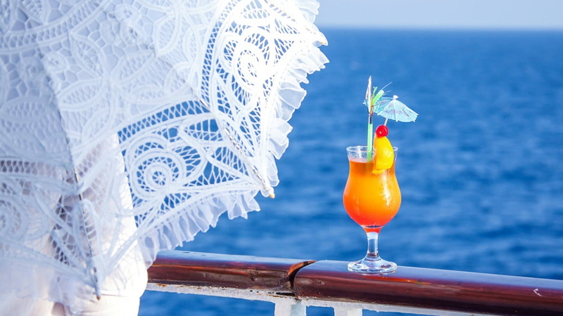 holding, household equipment, cocktail, garnish, juice, facing, drink, sea, seals, close-up, tropical drink, blue, refreshment, food and drink, drinking straw