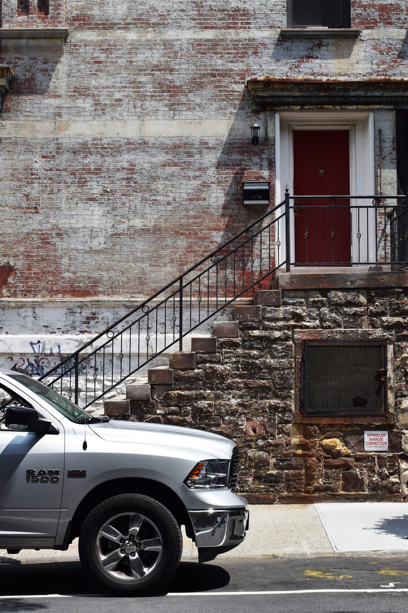 brown, sunlight, motor vehicle, wall, silver, railing, gray, mode of transportation, architecture, road, parking, stair, new york, day, ram, step, stone
