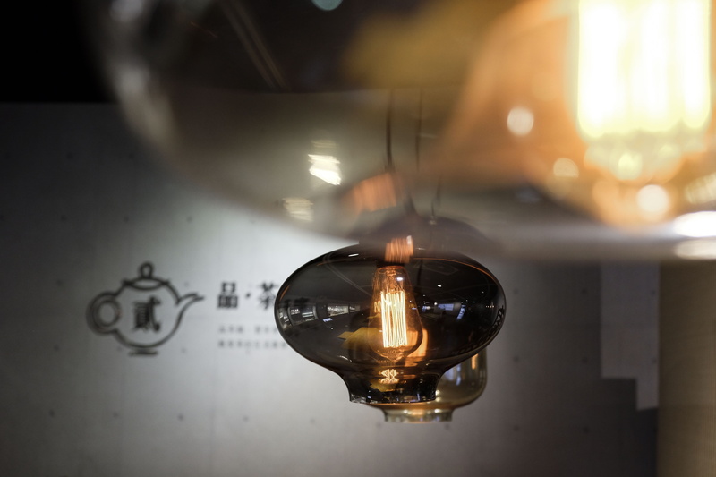 urban exploring, decoration, table, close-up, glass, chinese characters, new taipei, pinglin tea museum of new taipei city, selective focus, illuminated