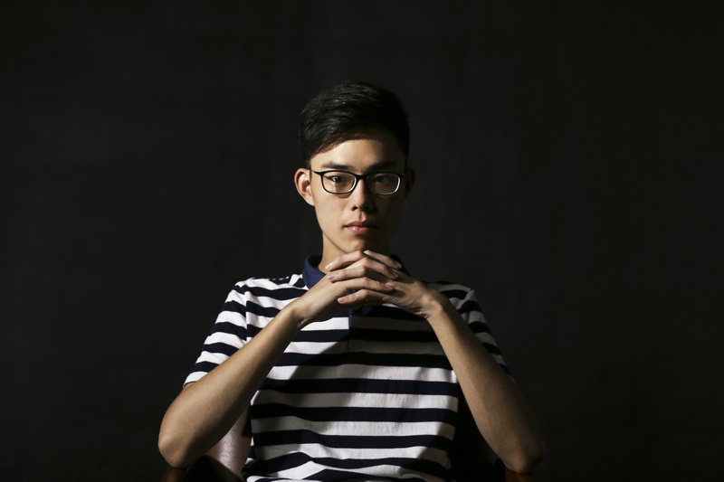 chinese, standing, thinking, t-shirts, beautiful, studio Shot, portrait, serious, looking at camera, young people, hand, dark, wearing, one Person, polo