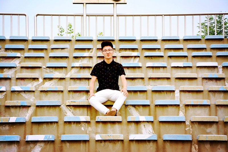 sitting, outdoor, sat, portrait, Vitality, casual clothing, young adult, chair, Character, built structure, 1080P, happiness, smiling, architecture, full length