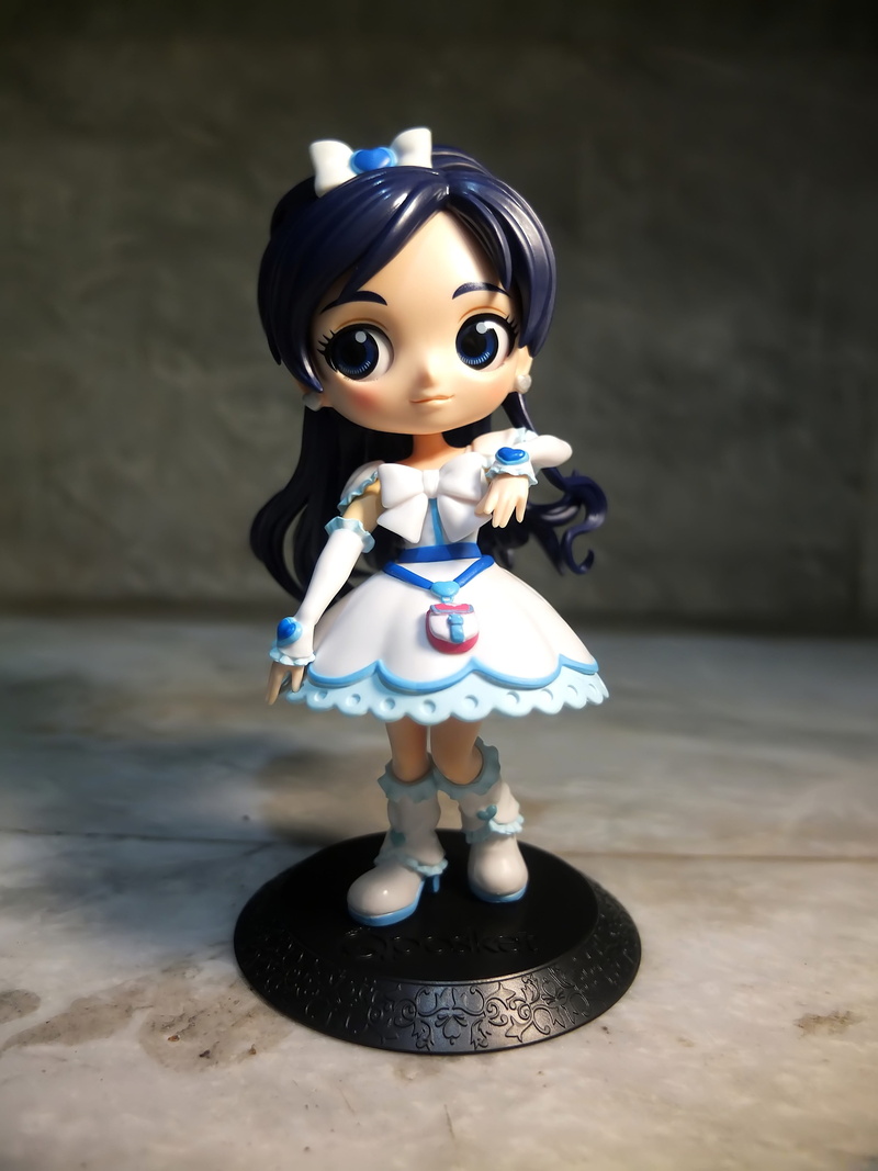 female, lighting equipment, version, illuminated, cartoon, close-up, still life, sculpture, anime, focus on foreground, original, indoors, toy, table, young