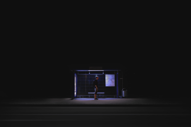 built structure, building, nightime, man, copy space, one person, shirt, black shirt, architecture, solitude, indoors, shed, men, real people, night, people