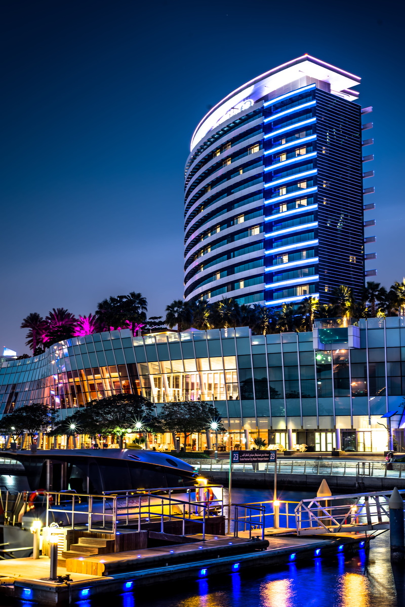building exterior, illuminated, nature, dock, lighted, clear sky, modern, transportation, nightime, pier, built structure, sky, skyscraper, blue, city life