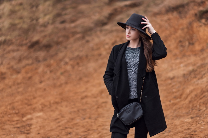 hairstyle, day, focus on foreground, looking into the distance, adult, real people, black pants, grey sweater, one person, beautiful woman, women, beauty