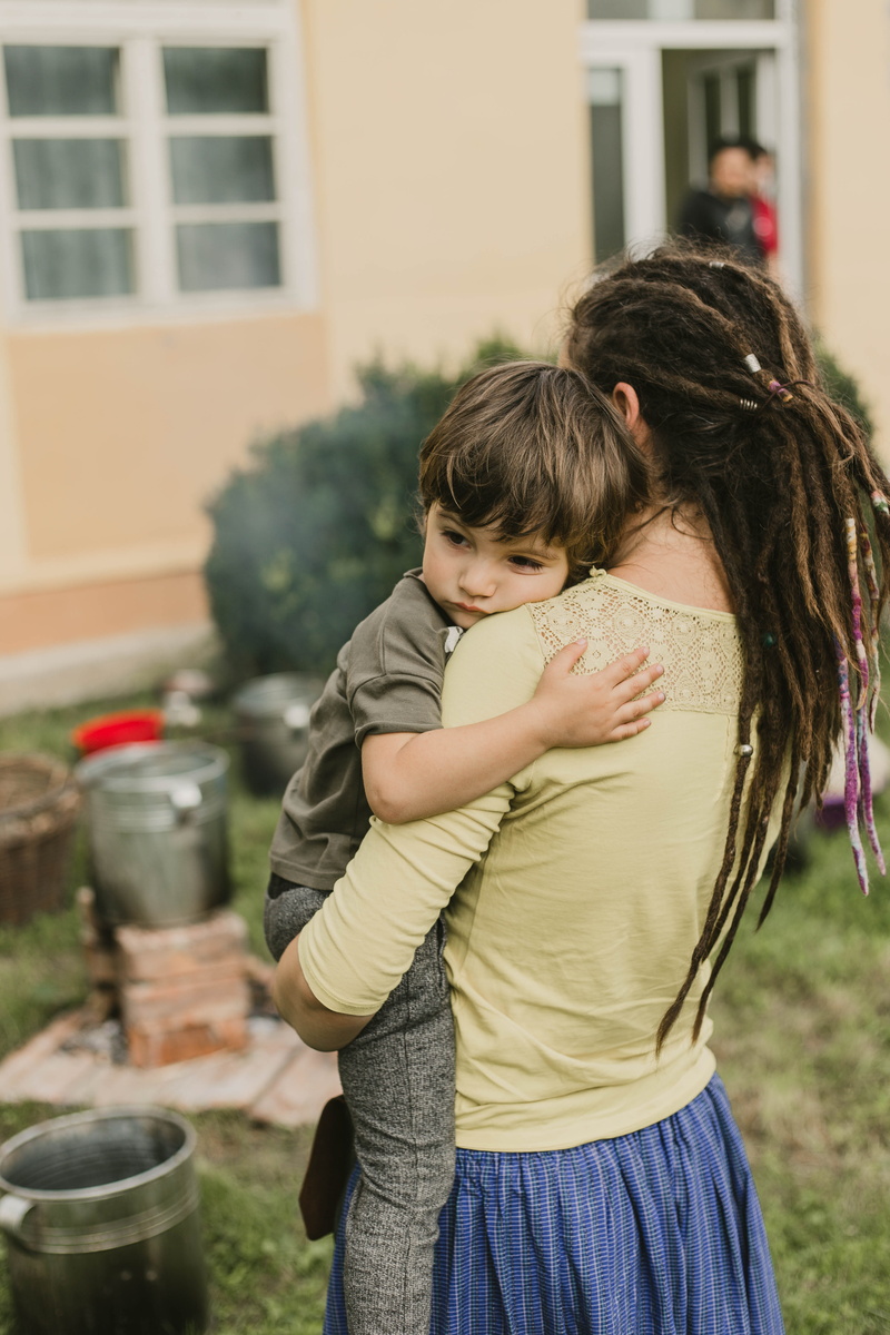 women, rastafari, females, togetherness, boy, childhood, child, family, bowl, girls, bonding, cup, man, motherhood, daytime, carrying, focus on foreground