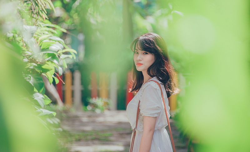 person, one person, outdoors, fashion, beautiful woman, standing, dress, beauty, hairstyle, lifestyles, selective focus, hair, leisure activity, model