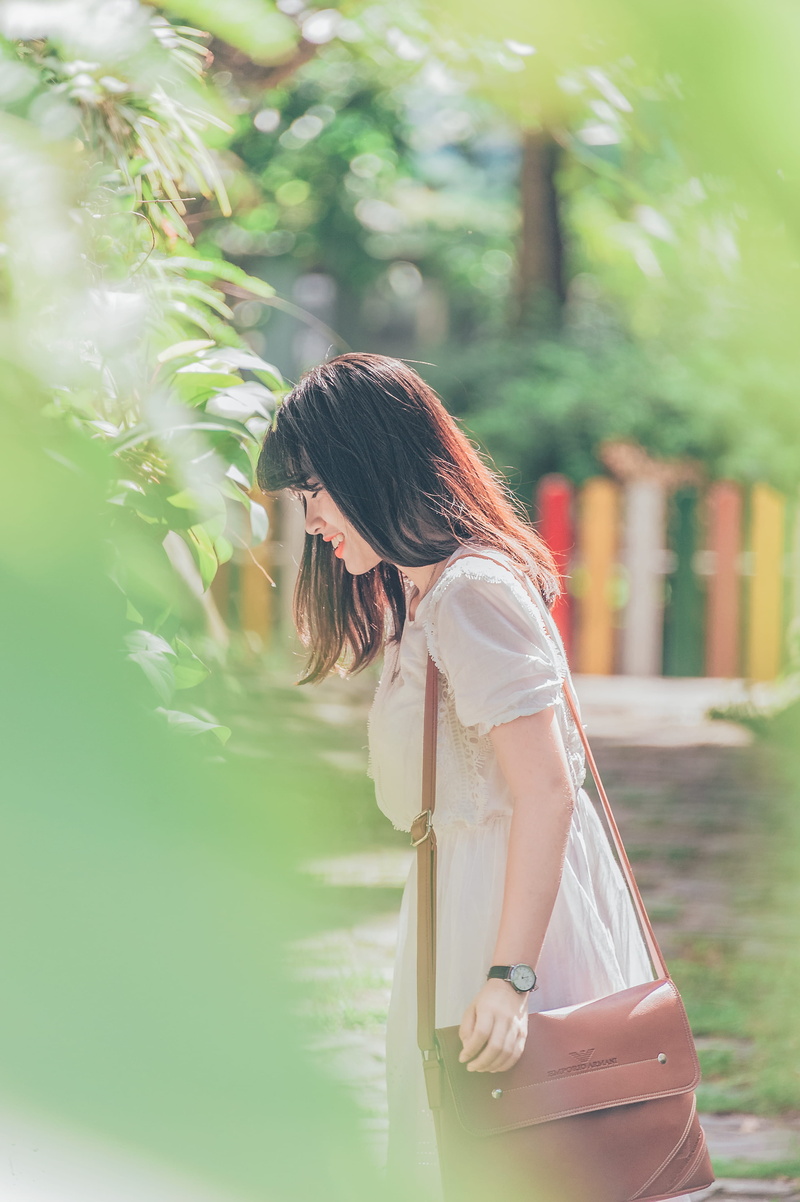 side view, one person, long hair, women, contemplation, young adult, outdoors, young women, bag, day, person, beauty, hair, woman, fashion, three quarter length