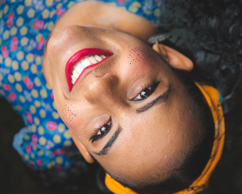 clean, indoors, female, happy, high, high angle view, real people, focus, upside down, story, blue, headshot, lipstick, human face, beautiful woman, shallow
