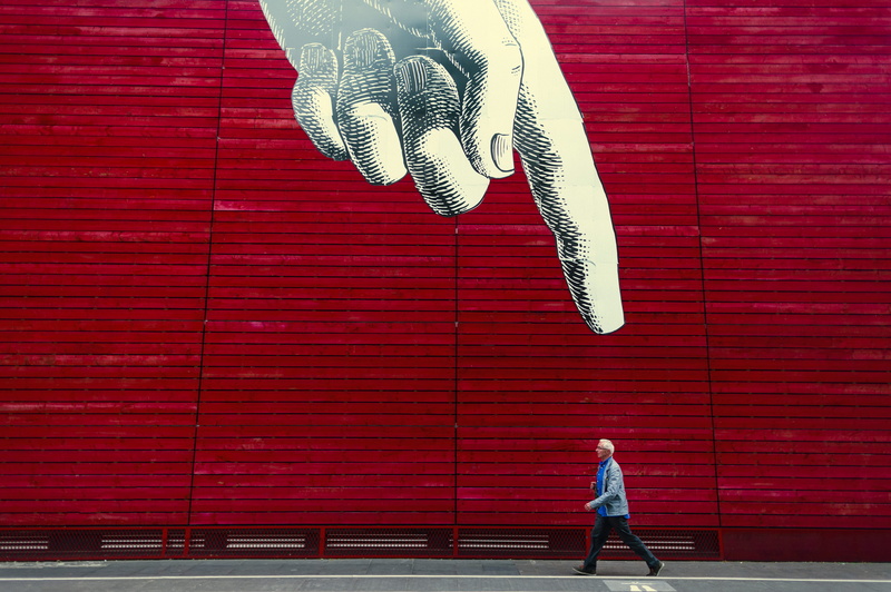 building exterior, built structure, brick wall, day, men, real people, realistic, index, outdoors, finger, brick, women, leisure activity, walking, standing