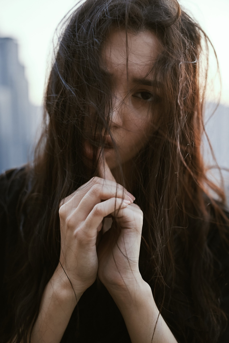 blank stare, brunette, obscured face, women, blank, person, dark, headshot, sad, real people, one person, index, front view, woman, a, looking, long hair