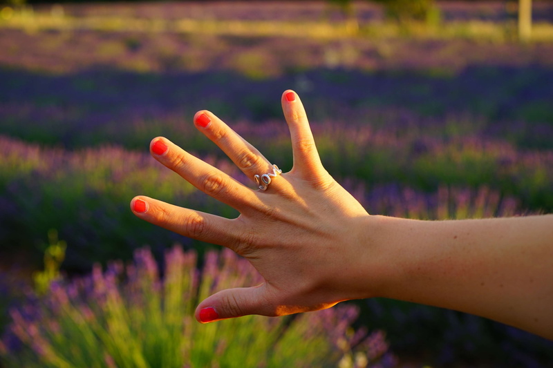 ring, flower, nail polish, day, purple, human body part, jewelry, love, pinkie finger, field, painted red, fingernails, ring finger, human hand, close-up