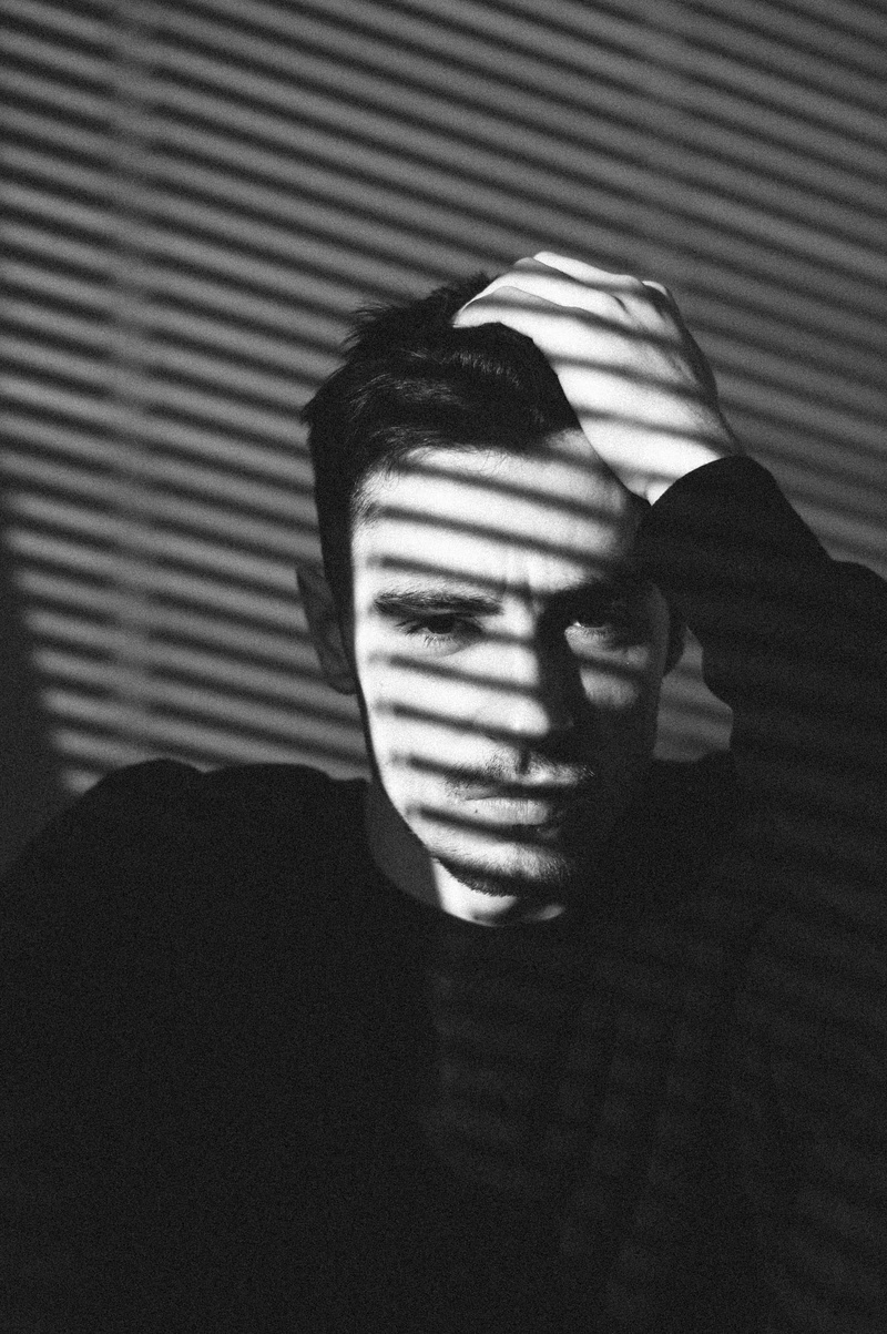 men, leisure activity, shadow, photo, headshot, obscured face, pattern, real people, line, striped, human face, black, finger, back, head, silhouette, domestic room