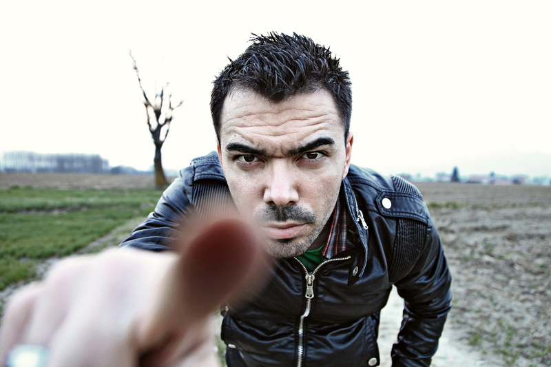 front view, man, headshot, face, black, nature, outdoors, beard, mid adult men, adult, anger, 5K, one Person, clothing, sky, pointing, hood - clothing