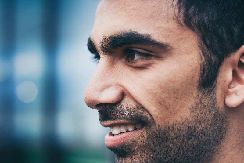 young men, mid adult men, looking away, skin, finger, profile view, human, close, handrail, focus on foreground, portrait, headshot, looking, man, contemplation