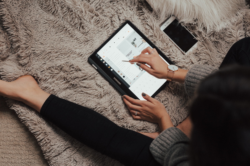 wearing, connection, using phone, rug, high angle view, 5K, computer, black, lying, apparel, cushion, tablet computer, technology, smart phone, mobile phone