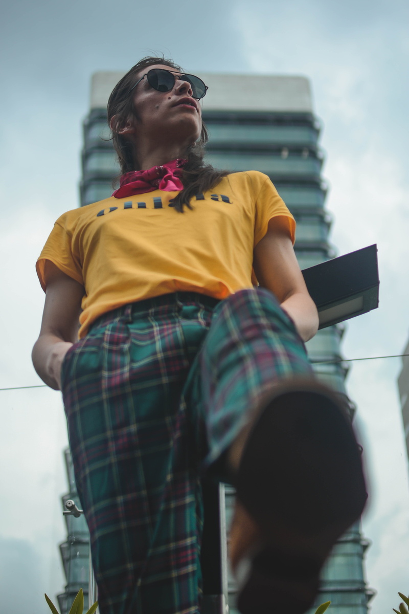 one person, face, casual clothing, electronics, three quarter length, architecture, medellín, day, nature, pc, outdoors, human, person, female, young adult