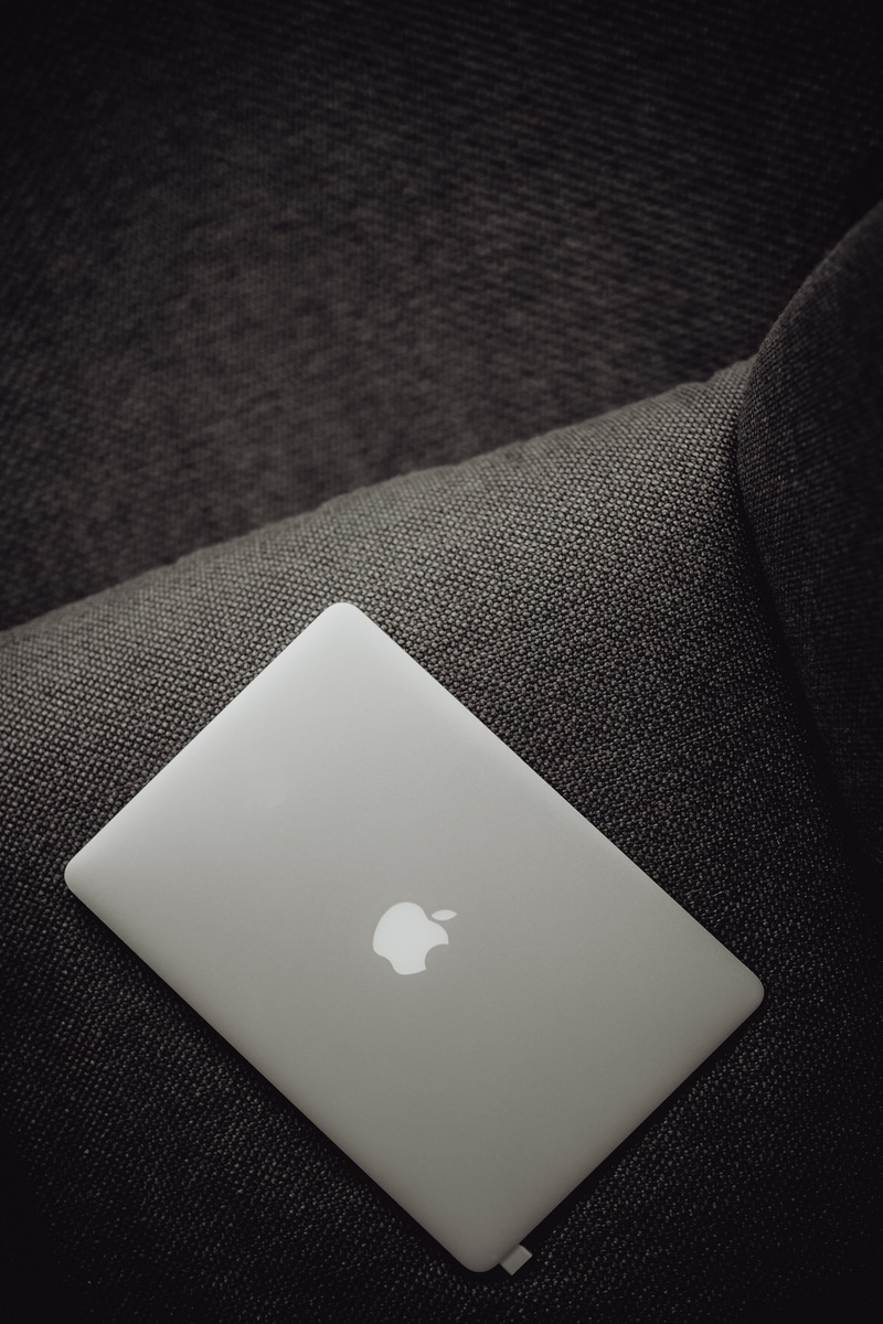 table, laptop, view, grey, close-up, computer, detail, heart shape, macbook, high angle view, jeans, indoors, lying, technology, single object, textured