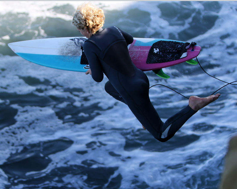 waterfront, day, leisure activity, rear view, beach, body, girl, holding, real people, wetsuit, surfboard, fun, surfboarding, aquatic sport, recreation