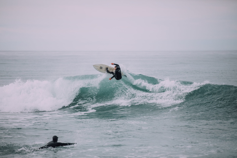 scenics - nature, real people, motion, water, surfing, jump, action, men, surfer, skill, leisure activity, black, rashguard, wafe, sport, extreme sports