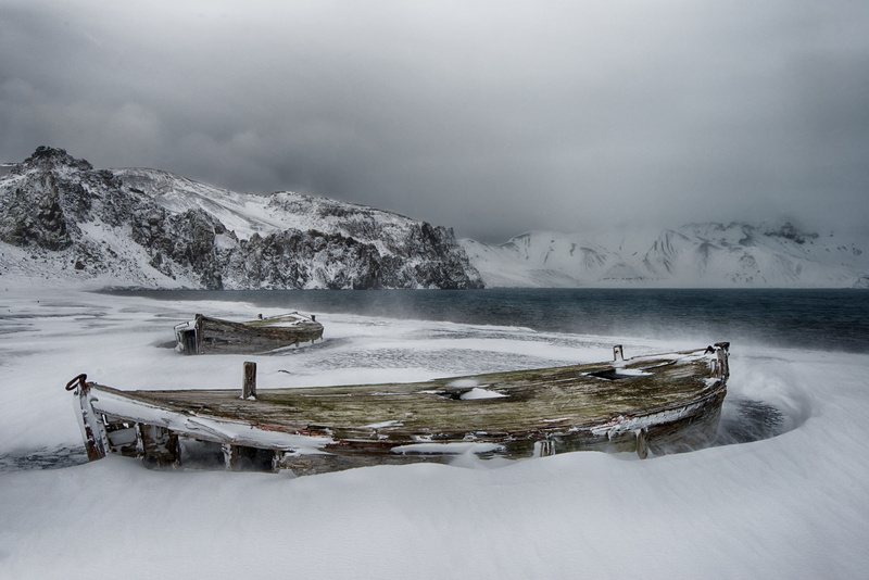 island of Deception, to the North of the Antarctic Peninsula, the archipelago of the South Shetland Islands, boats, snow, cold, abandonment, The Atlantic ocean