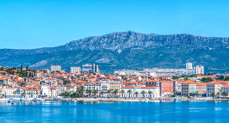 mountains, cityscape, built structure, outdoors, city, near, residential district, urban skyline, environment, dalmatia, no people, travel destinations