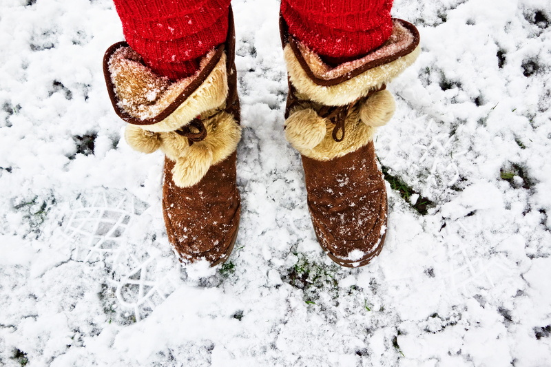 outdoors, human limb, snowing, covering, field, human body part, red leg warmer, boots, person, winter, socks, frozen, brown, extreme weather, footwear