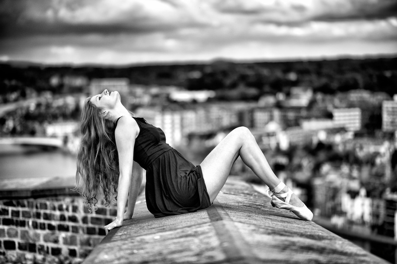day, women, ballet slippers, focus on foreground, one person, real people, relaxation, outdoors, built structure, closed eyes, cloud - sky, cityscape, young women