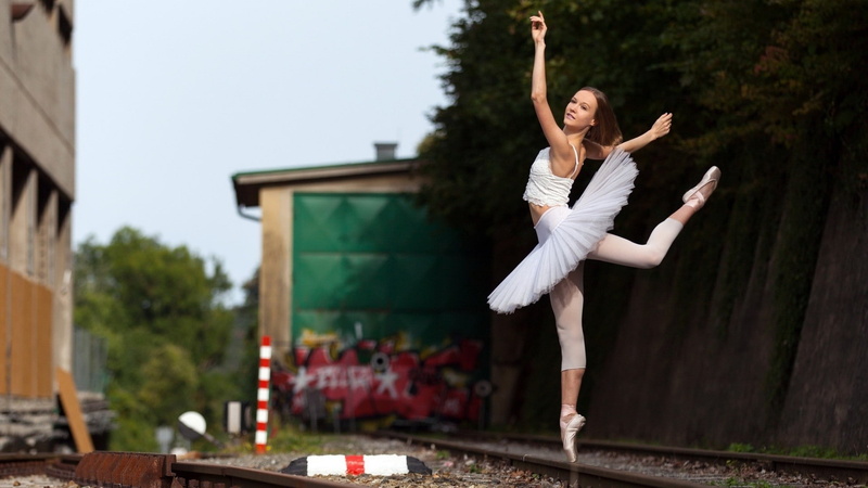 limb, casual clothing, railway, young adult, mid-air, nature, outdoors, lifestyles, real people, dancer, arms raised, human limb, young women, positive emotion