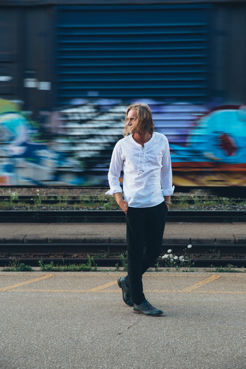 lifestyle, city, graffiti, model, walks, daytime, one person, youth, young men, male, mens shoes, fashion, men, transportation, railroad track, urban, Station